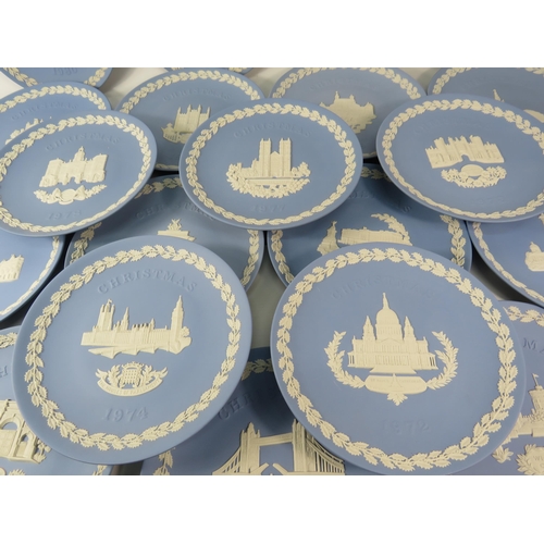 116 - Twenty Wedgewood blue jasperware christmas plates 1969 to 1988.