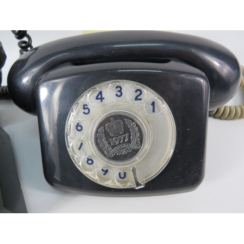 129 - Vintage Bakelite telephone plus a Silver Jubilee coin set telephone.