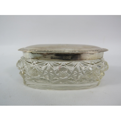 157 - Oval shaped sterling silver lidded dressing table pot Birmingham 1902.