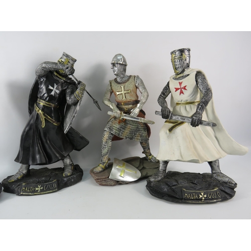 180 - Four large resin Knight figurines the tallest stands 13