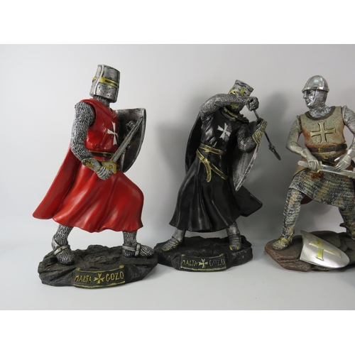 180 - Four large resin Knight figurines the tallest stands 13