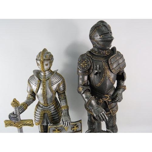 182 - Two very large resin knight figures the tallest stands, 24.5