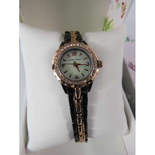 324 - Ladies Laura Ashley wristwatch and a ladies fitness tracker watch.