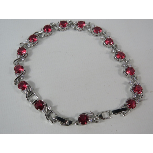 334 - 925 silver bracelet set with lab created CZ red stones, comes with extention link.