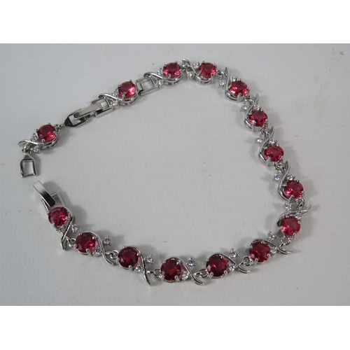 334 - 925 silver bracelet set with lab created CZ red stones, comes with extention link.