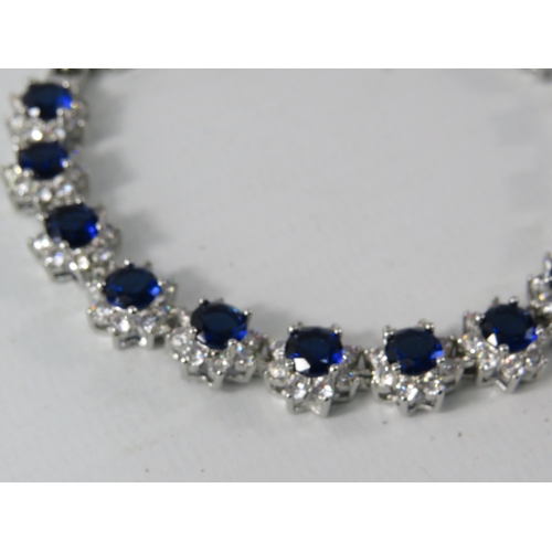 335 - 925 Silver bracelet set with lab created sapphire and Cz stones, comes with extention.