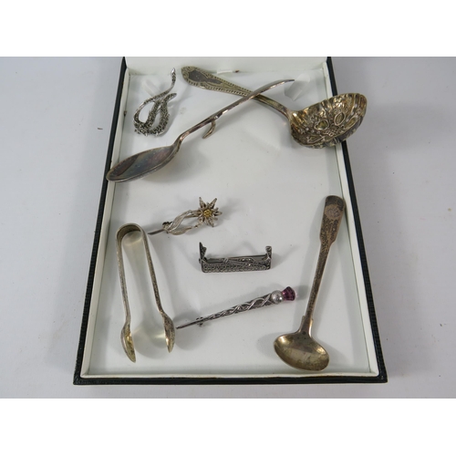 345 - Sterling silver condiment spoon, sugar nips and three brooches plus some silver plated items. 30 Gra... 