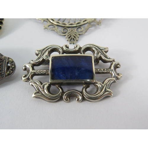 350 - Four Sterling silver vintage brooches, Whitby Jet, lapis, scottish silver and a Norwegian silver and... 