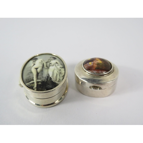 354 - Two sterling silver pill boxes with Risque designs to the top.