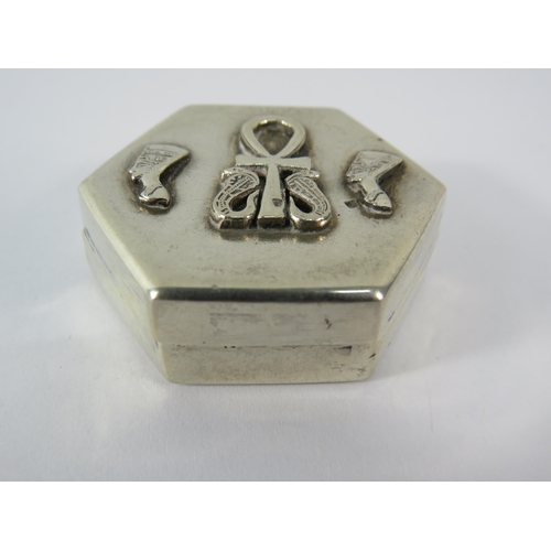 356 - 925 silver hexagon shaped pill box with Egyptian head and Ankh decoration to the top, 4cm by 3.5cm.