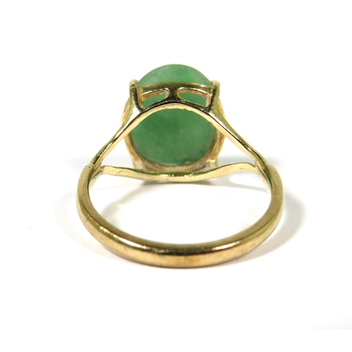 372 - 9ct Yellow Gold ring set with a large oval of Jade which measures 15 x 12 mm. Finger size Q-5.   3.6... 