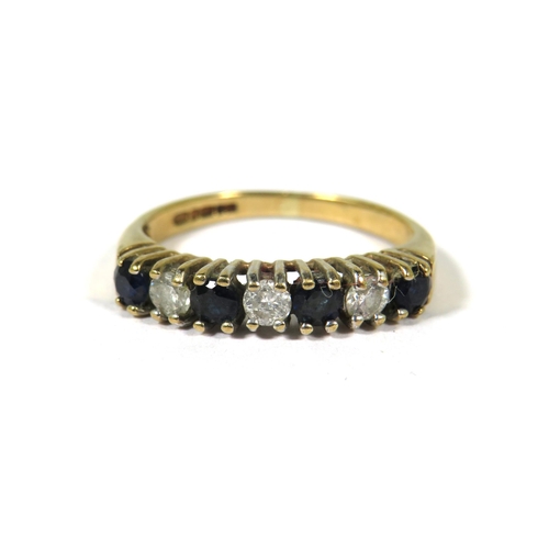 373 - 9ct Yellow Gold ring set with Four Sapphires and Three Diamonds.  Finger size K    1.7g