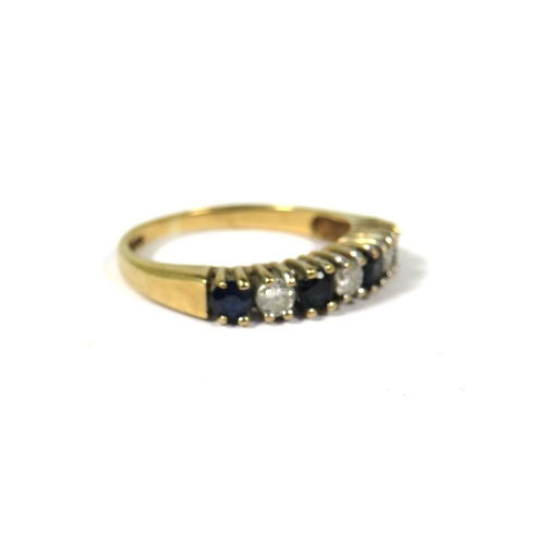 373 - 9ct Yellow Gold ring set with Four Sapphires and Three Diamonds.  Finger size K    1.7g