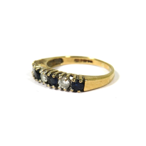 373 - 9ct Yellow Gold ring set with Four Sapphires and Three Diamonds.  Finger size K    1.7g