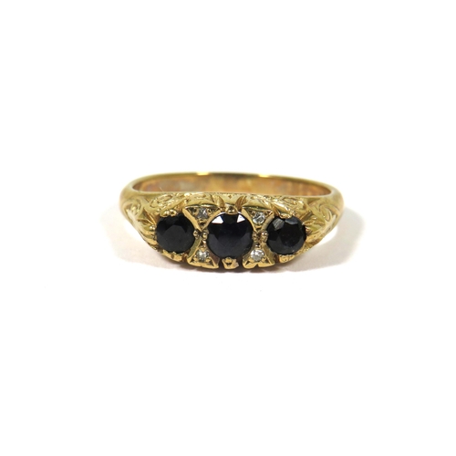 374 - 9ct Yellow Gold Gypsy Style Ring set with Three Sapphires with fancy scrolled mount. Finger size Q-5... 