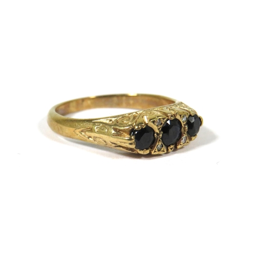 374 - 9ct Yellow Gold Gypsy Style Ring set with Three Sapphires with fancy scrolled mount. Finger size Q-5... 