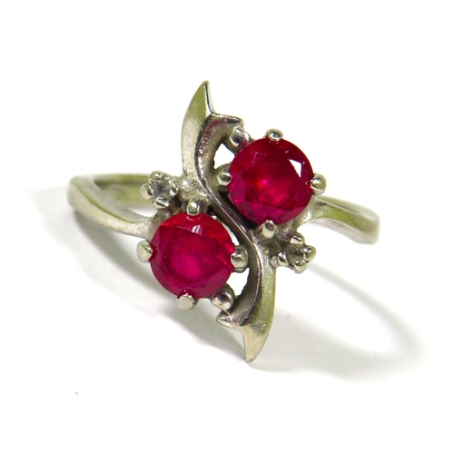 376 - Very Pretty Ring marked 10k set with two 5mm Rubies. Finger size N-5    3.4g