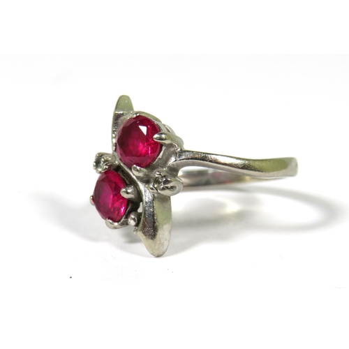 376 - Very Pretty Ring marked 10k set with two 5mm Rubies. Finger size N-5    3.4g