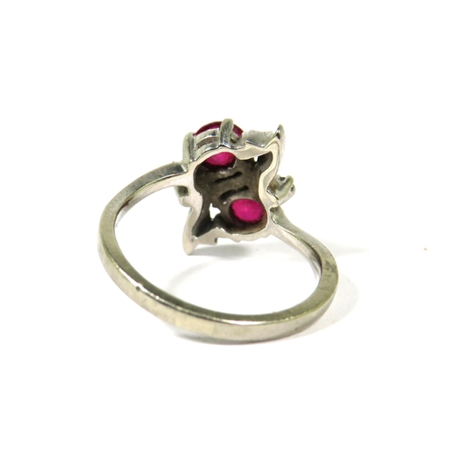 376 - Very Pretty Ring marked 10k set with two 5mm Rubies. Finger size N-5    3.4g