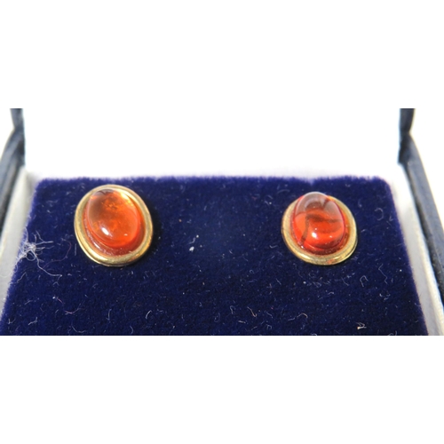 381 - Two Pairs of 9ct Ear studs, one pair set with Amber, the other set with Jade/ Neophrite.   See photo... 