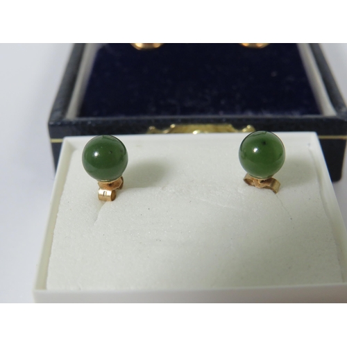 381 - Two Pairs of 9ct Ear studs, one pair set with Amber, the other set with Jade/ Neophrite.   See photo... 