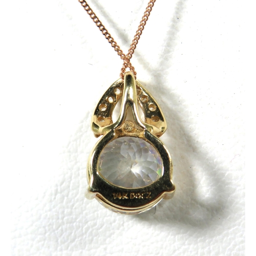 387 - 14Ct Yellow Gold Pendant set with a 8mm CZ Gemstone attached to an 18 inch 9ct Yellow Gold Trace cha... 