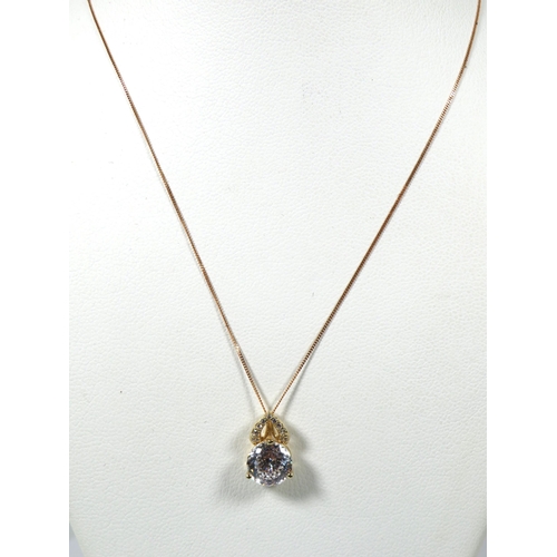 387 - 14Ct Yellow Gold Pendant set with a 8mm CZ Gemstone attached to an 18 inch 9ct Yellow Gold Trace cha... 