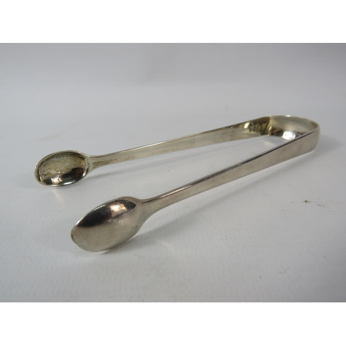 405 - Georgian sterling silver sugar tongs 30.4 grams.