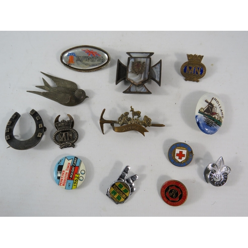 409 - Selection of vintage badges and brooches some which are sterling silver.