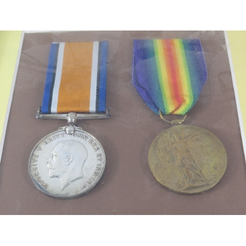 412 - Two WW1 medals awarded to 250012 T. Humphreys Royal Horse Artillary, mounted in a frame.