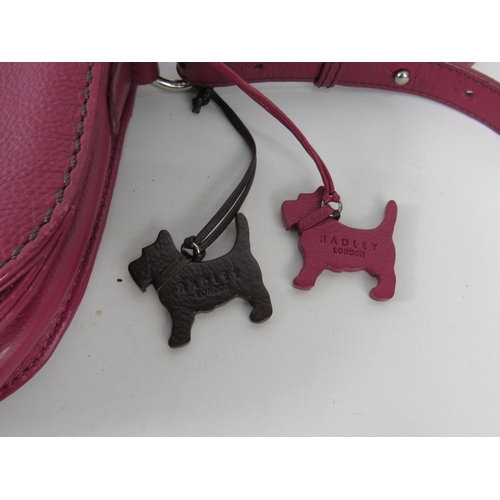 416 - Ladies Fuchsia leather Radley handbag with very little use.