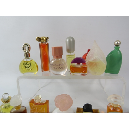 429 - 25 Womens miniature fragrances including Estee lauder, Givenchy, Hemes etc.