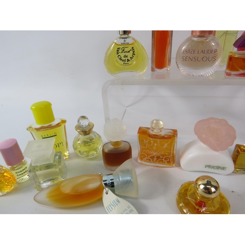 429 - 25 Womens miniature fragrances including Estee lauder, Givenchy, Hemes etc.