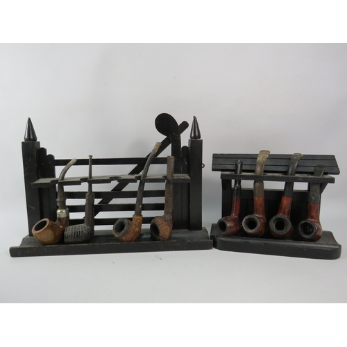 489 - Two pipe racks and eight smokers pipes.