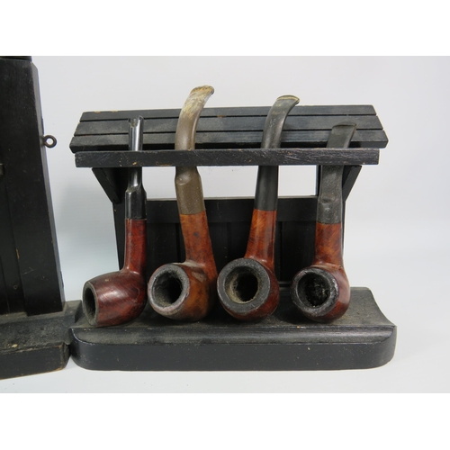 489 - Two pipe racks and eight smokers pipes.