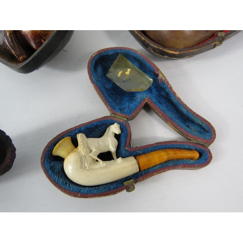 494 - Good selection of smokers pipes including three Meerschaum and one which is hand finshed with sterli... 