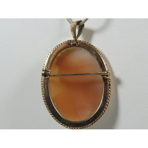 395 - Unmarked (chem tested) 9ct Yellow Gold Cameo Shell Brooch/Pendant which measures 35 x 28 mm. 7.8g to... 