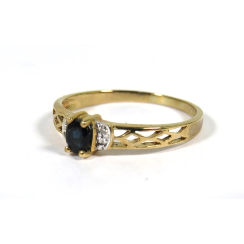 506 - New and Unused 9ct Yellow Gold ring with pierced shoulders  set with a small oval central Sapphire w... 