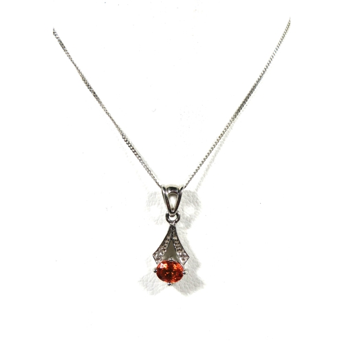 518 - Lovely 9ct White Gold Pendant set with a deep Orange coloured stone. Chain measures 16 inches long. ... 