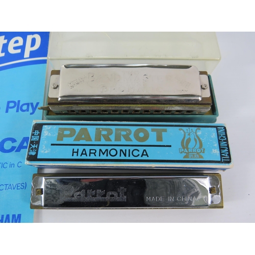 561 - Two Harmonicas and a how to play book.