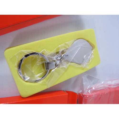 565 - Seven Key ring magnifying glasses.