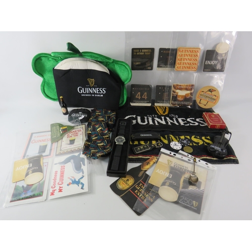 579 - Selection of Guinness collectable items, beer mats, watch, hat etc.