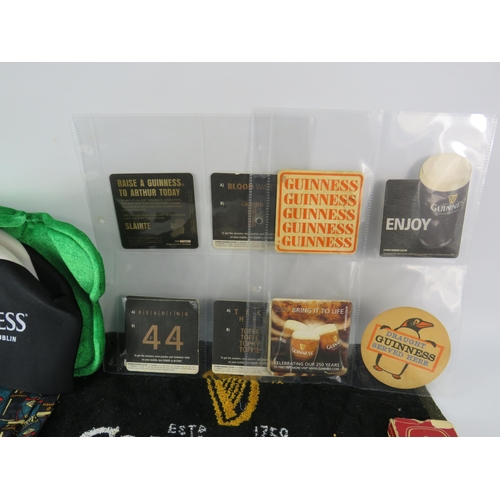 579 - Selection of Guinness collectable items, beer mats, watch, hat etc.