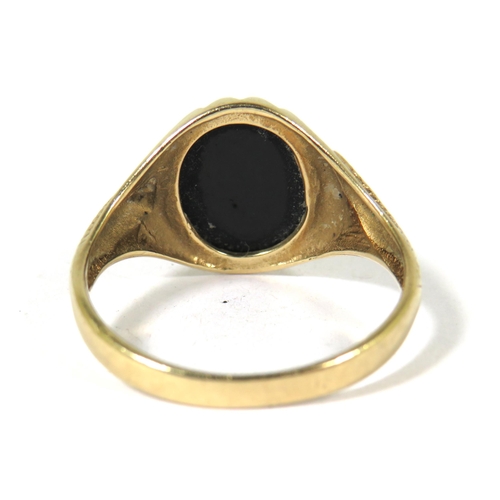 528A - 9ct Yellow Gold Ring set with a circular Black Onyx Stone which has a snake entwined on the shank an... 