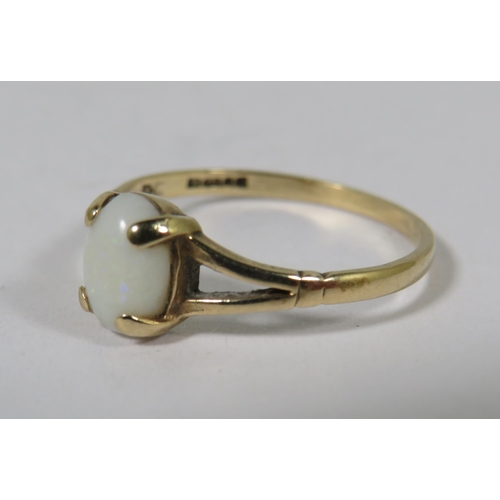 534A - 9ct Yellow Gold Ring set with a small white Opal which measures approx 7 x 5 mm.  Finger size 'M'   ... 