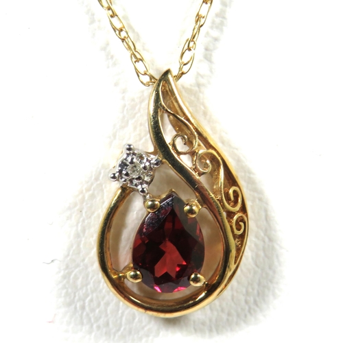 541A - 9ct Yellow Gold Pendant set with an Almond Shaped Garnet with tiny Diamond above. Hung on a 18 inch ... 