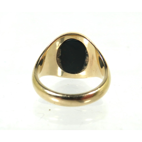 335A - 9ct Yellow Gold Signet ring set with a Bloodstone Seal. Finger size M  6.3g