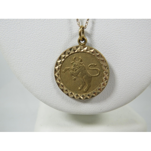 337A - 9ct Yellow Gold Circular Zodiac Pendant showing Taurus which measures 20mm wide. Hung on a 22 inch 9... 