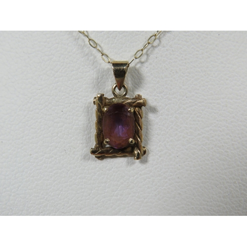 338A - Small Amethyst set 9ct Pendant set on a 15 inch 9ct yellow gold chain. Total weight 1.0g