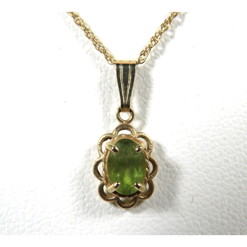 339A - Small Peridot set 9ct Pendant hung on a 16 inch 9ct Yellow Gold Chain.  Total weight 1.3g